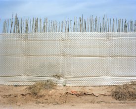 Corinne Silva 'Demarcation Line II, perimeter fence, poly-tunnel development' from 'Badlands' (2008-2011) © Corinne Silva