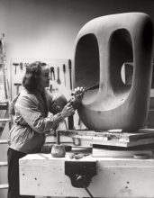 Barbara Hepworth in the Palais de la Danse studio, St Ives, at work on the wood carving Hollow Form with White Interior 1963 Photograph Val Wilmer © Bowness