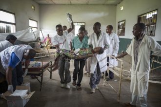20/10/2016. Médecins Sans Frontières staff tend to Felly Katembo, 13, at the Gang hospital in rural Democratic Republic of Congo. Felly had contracted Typhoid, the disease that in a couple of hours time will have claimed her life. © Charlie Bibby