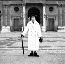 Model having fun at the end of the fashion shoot, Ready-to-wear, Louvre, Paris, c1950. © Marilyn Stafford