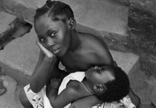 James Barnor, A Young girl with a boy strapped to her back, Ghana, early 1970s
