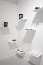 Overview of some the photobook maquettes, presented on shelves to mimic a library. Part of the Edition I of the Abysm, at Elysium Gallery, Swansea, UK