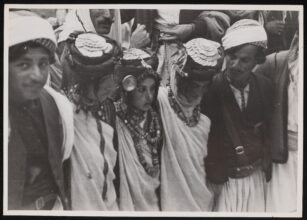 A group of women and men taking part in the Dabke dance at the annual Yazidi festival at Lalish. 18 October 1946 / Anthony Kersting