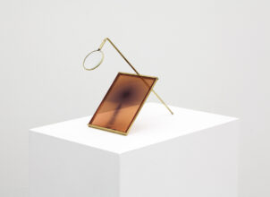 Juuso Noronkoski, Device No:1 (The Madness of the Day), 2018. Sunlight on photographic negative, brass, magnifying glass.