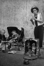 Woman street musician and her children, London (c.1990)