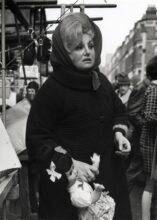 Chapel Market, Islington woman with doll © Dorothy Bohm