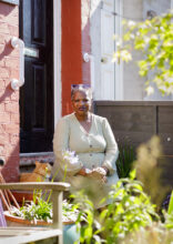 Pauline Omoboye, resident of New Longsight Housing Coop, artist and poet, 2023 © Roxana Allison