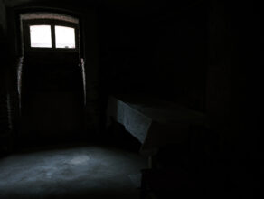 Hadamar: Autopsy table covered in cloth window to courtyard and bus shelter © Richard Wood