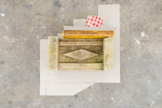 Joshua Phillips, One Feels an Old Life is Dead (a new half-life struggles on), book, stone, Bonne Maman jar, acorns, card, pencil, 2024